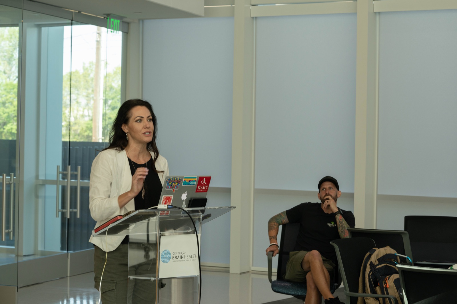A researcher presenting at the Center for BrainHealth, a UT-Dallas neuroscience partner, to a Birds Eye View participant